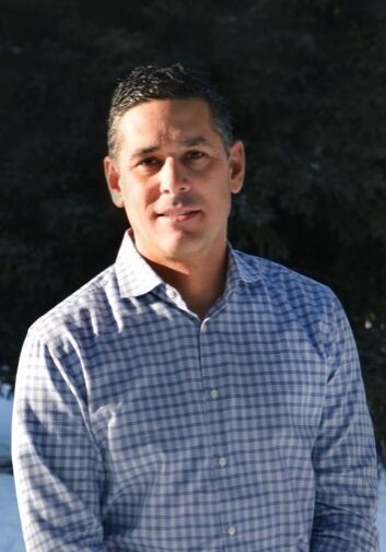 man wearing checked blue shirt